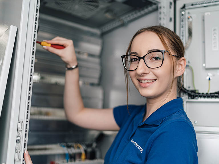 Trainee learning the job with trainer at Precitec