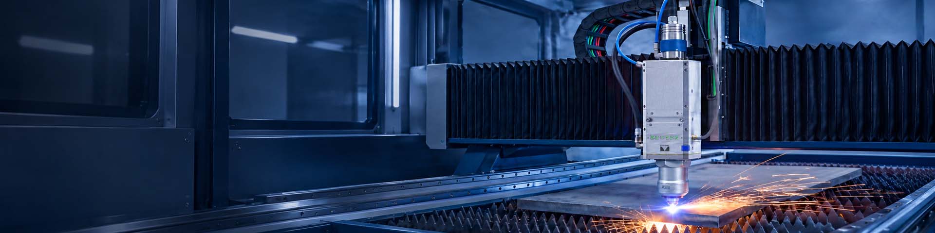 ProCutter 3.0 – Laser cutting head for automated 2D laser cutting Precitec ProCutter 3.0 laser cutting head cutting a metal plate on a flatbed laser cutting machine, with visible sparks